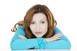 Pretty, happy woman in casual clothes sitting at the desk