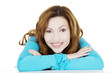 Pretty, happy woman in casual clothes sitting at the desk