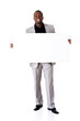 Photo: Happy successful businessman holding blank advertisement. Happy successful businessman holding blank advertisement.
