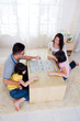 Asian family playing chinese chess
