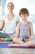Mother and son doing yoga