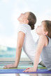 Photo: Mother and son doing exercise at home Mother and son doing exercise at home