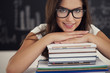Beautiful female student with books