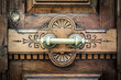 Detail of door with metal handle and keyhole.