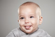 Portrait of a baby sticking his tongue