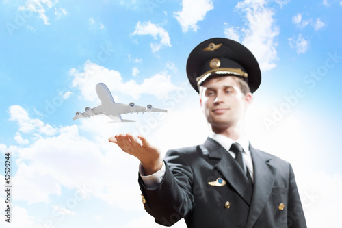 Photo: Image of pilot with plane in hand Image of pilot with plane in hand