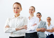 Four businesswomen standing in row