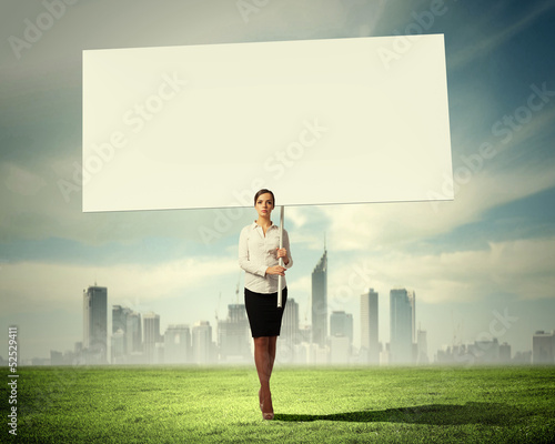 Photo: Woman holding blank board Woman holding blank board