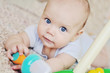Photo: blue eyed baby with toys blue eyed baby with toys