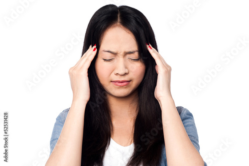Photo: Young girl having headache Young girl having headache