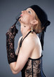 woman in hat with veil and underwear