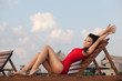 Hot brunette in red swimsuit