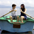 Beautiful wife and husband in love on boat in vacation