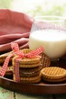 Photo: homemade cookies (sandwich) with milk on a wooden table homemade cookies (sandwich) with milk on a wooden table