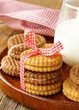 Photo: homemade cookies (sandwich) with milk on a wooden table homemade cookies (sandwich) with milk on a wooden table