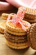 Photo: homemade cookies (sandwich) with milk on a wooden table homemade cookies (sandwich) with milk on a wooden table