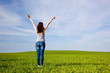 Young beautiful woman with hands up