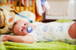 A baby waiting for changing his napkin