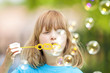 boy blowing bubbles