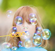 boy blowing bubbles