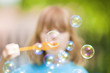 boy blowing bubbles