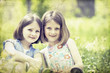 Photo: Old photo of happy children lying on green grass outdoors Old photo of happy children lying on green grass outdoors