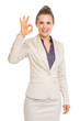 Smiling business woman showing ok gesture