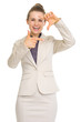 Happy business woman framing with hands