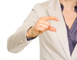 Closeup on business woman showing small risks gesture