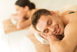 couple in spa with hot stones