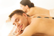 couple in spa with hot stones