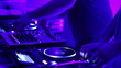 Two DJ playing simultaneously behind the deck