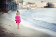 little girl walking on coast