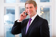 Photo: Laywer or Businessperson in Office on the phone Laywer or Businessperson in Office on the phone