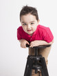 funny young boy playing in front of the camera
