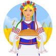 Young woman in ukrainian clothes, with garland and round loaf