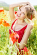 beautiful blonde girl in poppies field