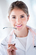 Female doctor holding glasses
