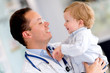 Doctor holding a baby