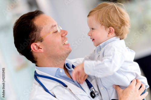 Photo: Doctor holding a baby Doctor holding a baby