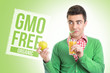 Young man with healthy GMO free juice and apple