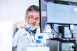 Senior male researcher carrying out scientific research in a lab