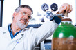 Senior male researcher carrying out scientific research in a lab