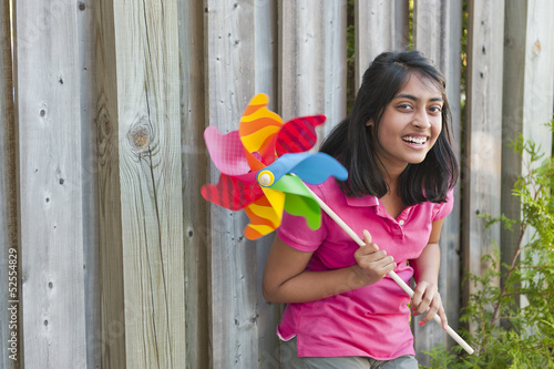 Photo: teenage girl with pinwheel teenage girl with pinwheel