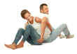 Portrait of young happy smiling couple sitting on the floor