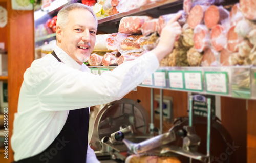 Photo: Smiling shopkeeper Smiling shopkeeper