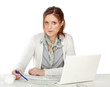 A young woman sitting at her workplace
