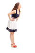 Full length portrait of a young woman in profile looking upwards