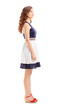 Full length portrait of a young woman in profile