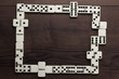 domino pieces on wooden table background